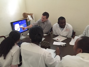 Dr Gabriel Runner teaches at a computer donated by another UC Davis radiology resident.